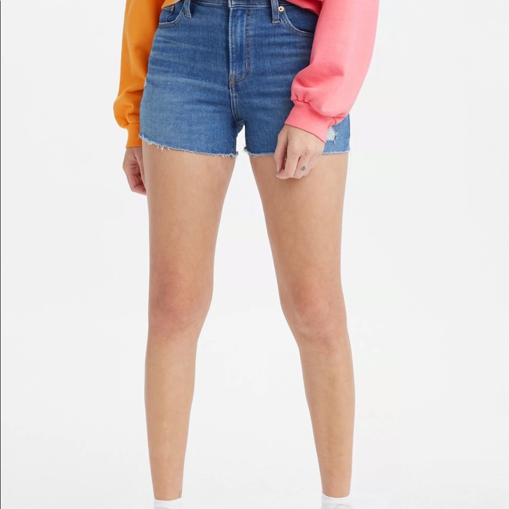 Levi's size 10 W30 medium wash high rise shorts